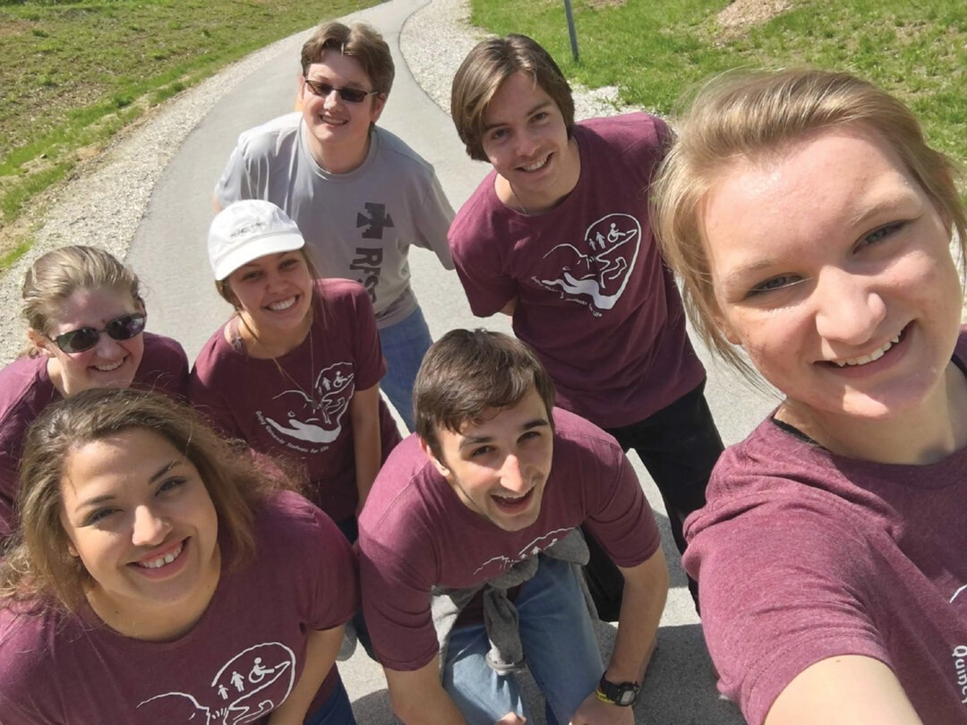 7_original_file_I0 Lydia (front right corner) and David Spillman (middle of group) take a walk on Bob Mays trail with members of the Quincy University Students for Life after participating in the Dogwood parade, May 2018.