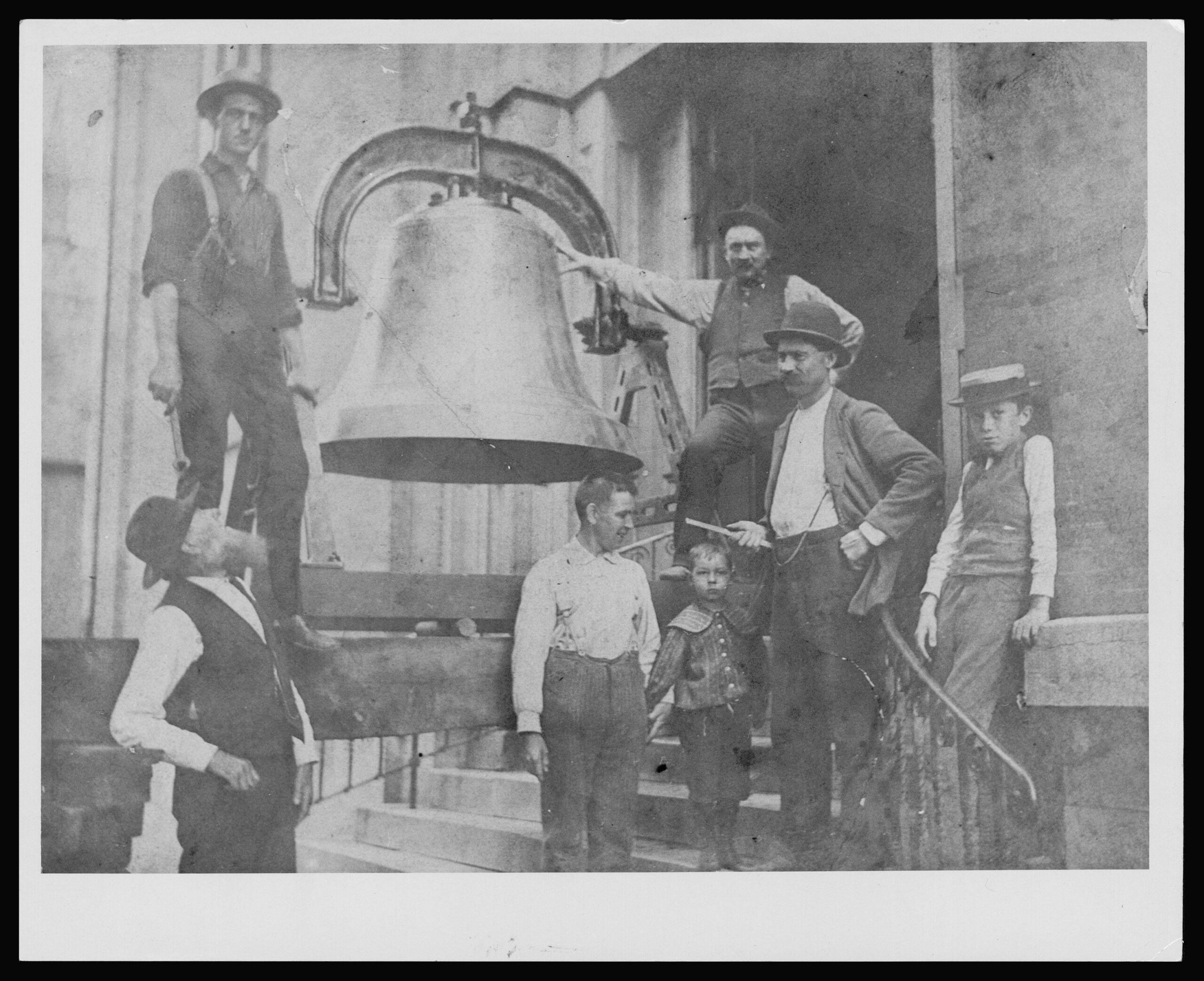 Workers raising the bell into the St. Francis Solanus steeple in 1886