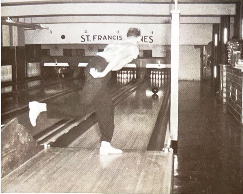 A bowler mid-throw on the St. Francis Lanes in the school basement