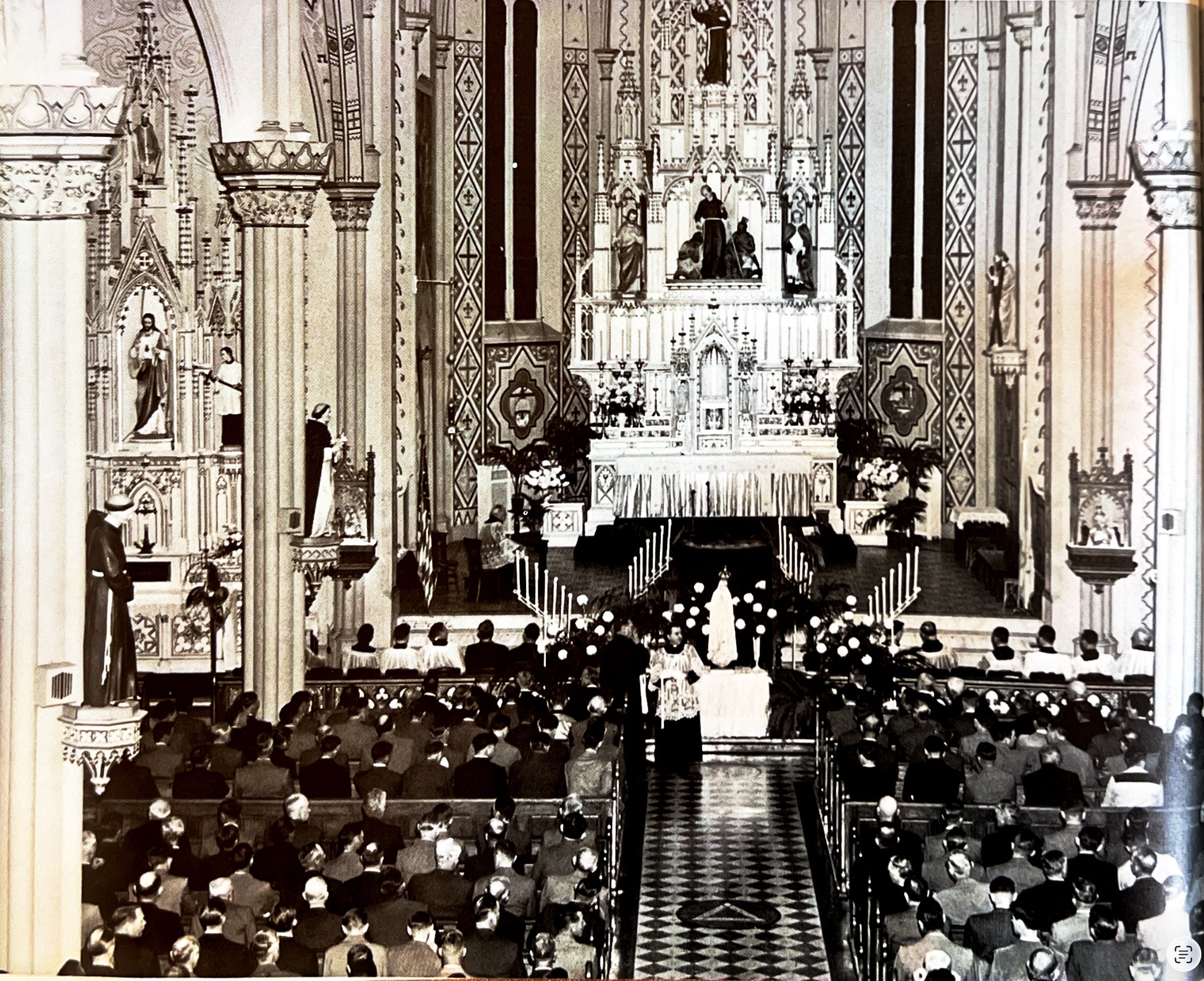 An early black and white photo of the St. Francis Solanus Church interior and high altar
